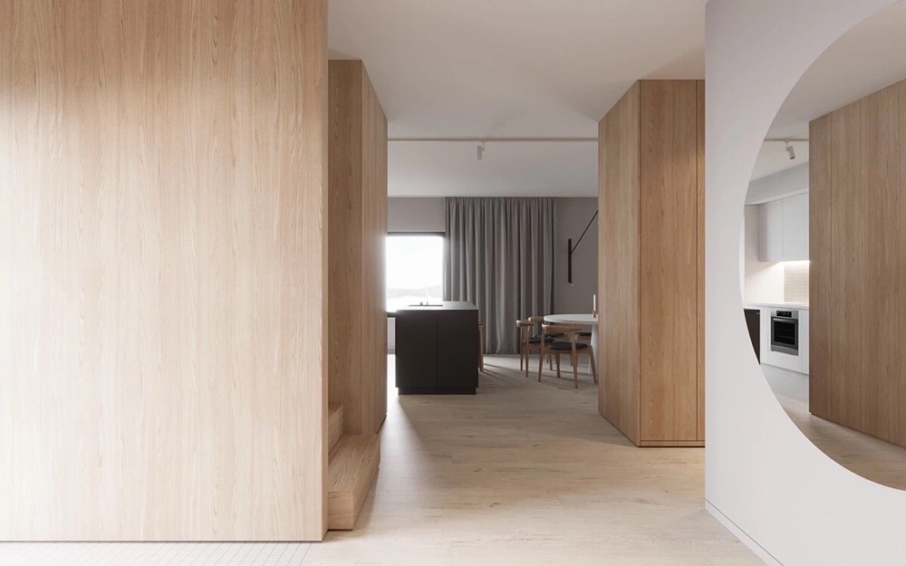 玄关的木制衣柜与白墙相对没有做任何造型简单大方转角的圆