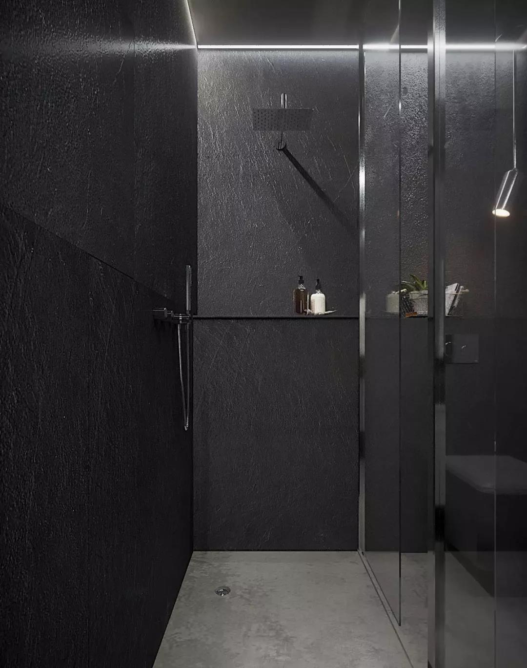 以黑色为主的卫生间地面墙面洗漱台所有的一切装饰都