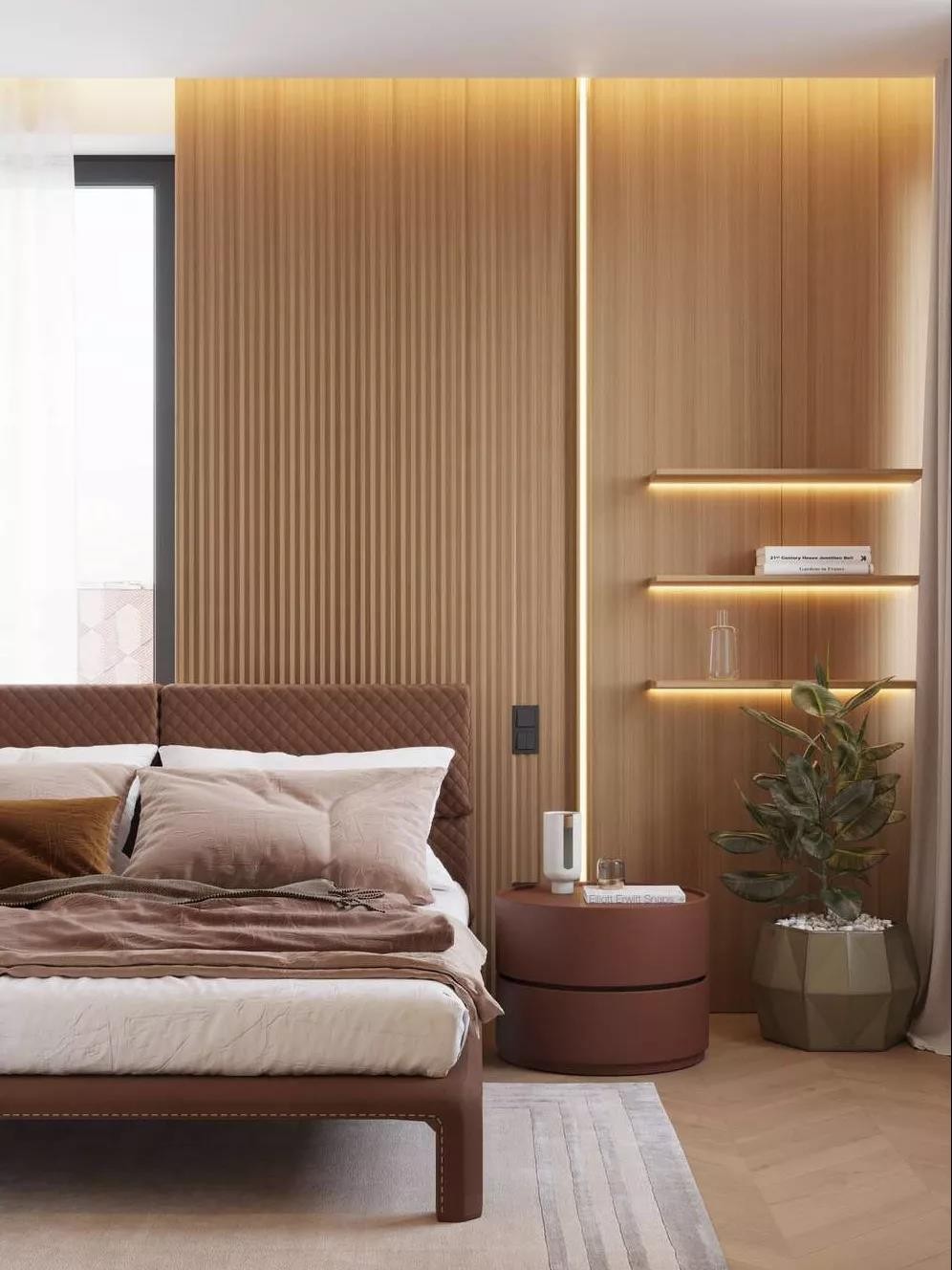 卧室内大面积的使用原木饰面装饰  深棕色皮质床体和床头柜  带来舒适